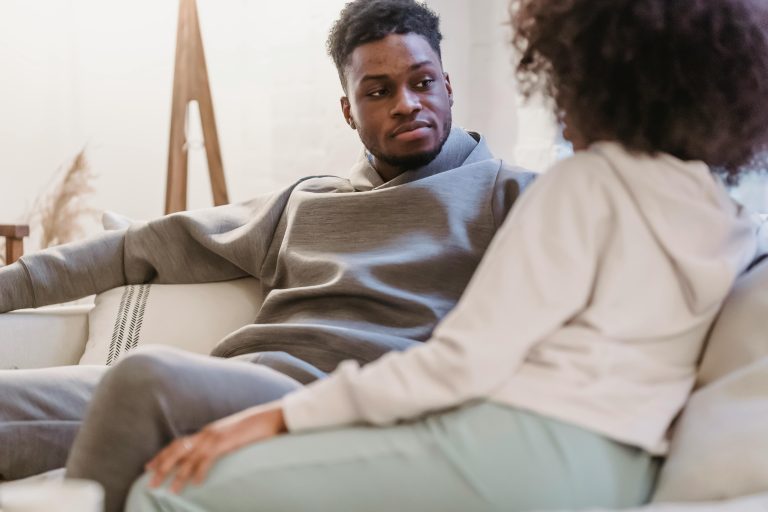 Man listening attentively to his wife during a conversation, demonstrating active listening, empathy, emotional validation, and effective communication skills that strengthen trust and connection in marriage.